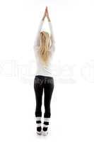back pose of woman exercising