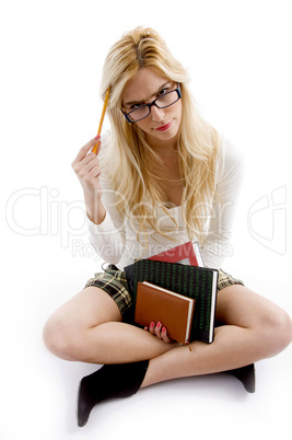 front view of smiling young student holding books