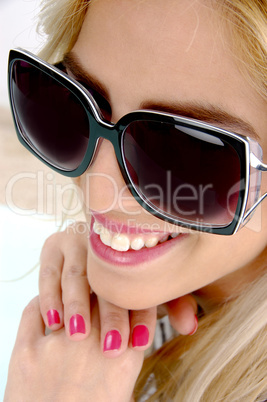 close up view of smiling female with sunglasses