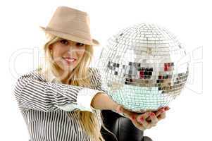 portrait of smiling woman showing disco ball