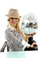 side pose of smiling woman holding disco ball