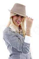 side view of smiling female holding hat