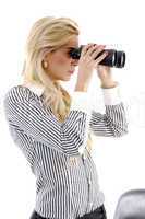 side view of woman watching through binocular