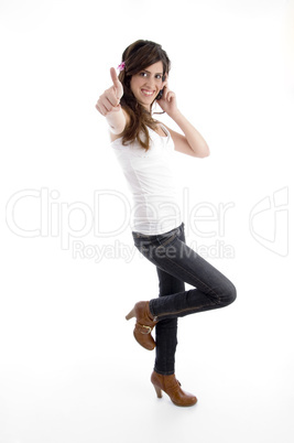 standing woman with cell phone wishing good luck