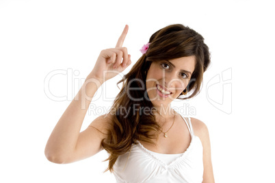 smiling female showing index finger