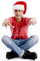 christmas hat wearing male pointing at camera