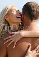 Couple embracing outdoors smiling