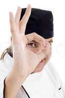 chef looking through finger hole