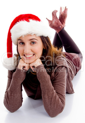 young woman in christmas hat smiling at camera