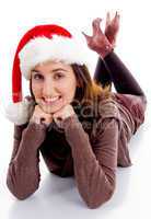 young woman in christmas hat smiling at camera
