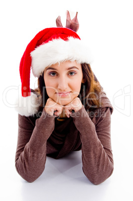 female in christmas hat lying on floor