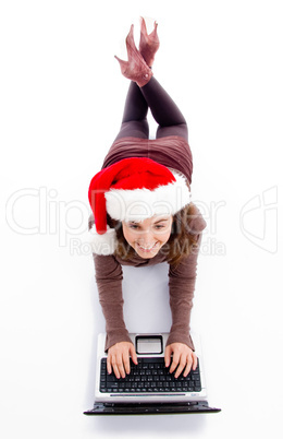 female lying on floor working on laptop