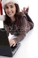 female lying on floor working on laptop