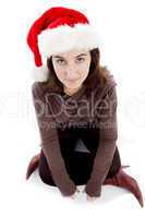 female in christmas hat sitting on floor