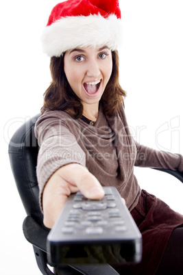 woman in christmas hat watching television