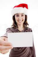 woman wearing christmas hat holding business card