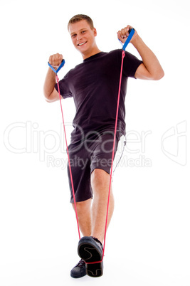 fitness man posing with stretching rope