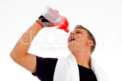 muscular man posing with water bottle
