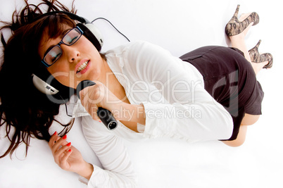 top view of singing woman listening music