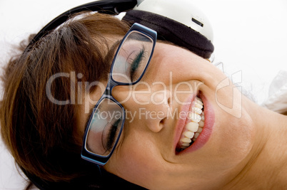 close up of smiling woman listening to music