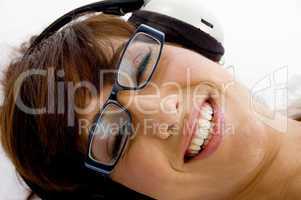 close up of smiling woman listening to music