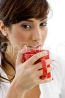 front view of female accountant drinking coffee