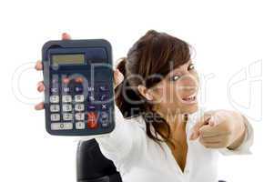 front view of female attorney with pointing finger and holding calculator