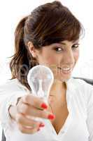 front view of smiling businesswoman holding electric bulb