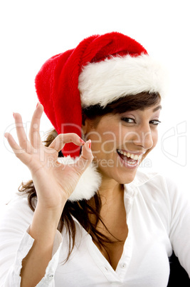 front view of happy female accountant wearing christmas hat gesturing