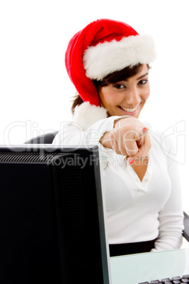 front view of smiling christmas woman pointing