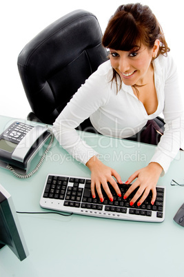 top view of woman working on computer