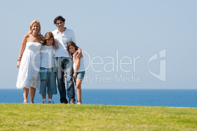 Family of four on meadow