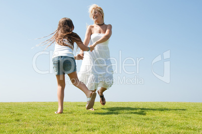 Young mother playing with daughter