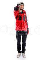 handsome young caucasian in winter clothes with thumbs up hand gesture
