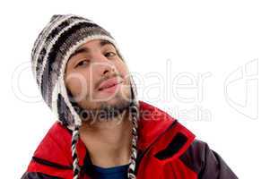 handsome young caucasian in winter clothes looking at camera