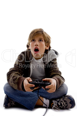 front view of amazed kid playing computer game