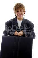 front view of tired young businessman holding briefcase