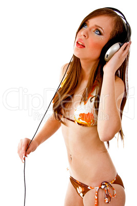 side view of sensual female holding headphone