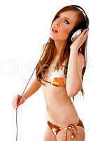 side view of sensual female holding headphone