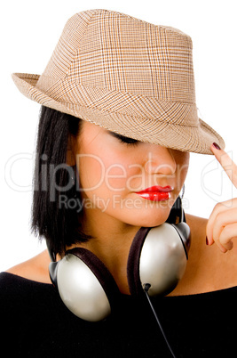 portrait of young female wearing headphone and hat