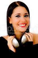 portrait of smiling young female holding headphone