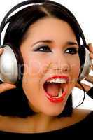 portrait of happy beautiful female listening music
