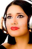portrait of smiling beautiful woman listening music