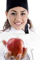 professional female chef showing fresh apple