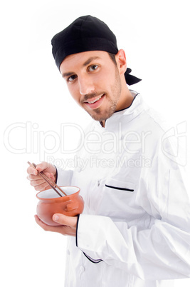 professional chef holding bowl and chopstick