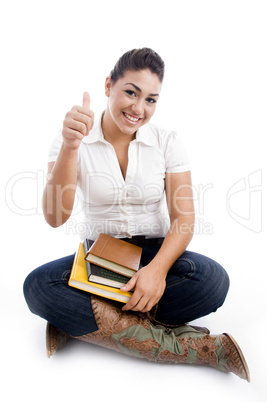 pointing female holding books