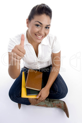 teenager pretty girl posing with thumbs up