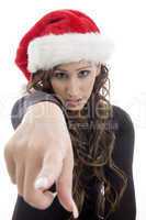 woman wearing christmas hat pointing you