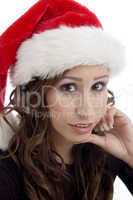 close up of woman wearing christmas hat