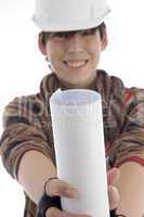 smiling young architect showing paper roll